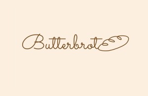 Logoentwurf für butterbrot-Bäckerei – schriftzug mit liniengrafik in form eines brotlaibes